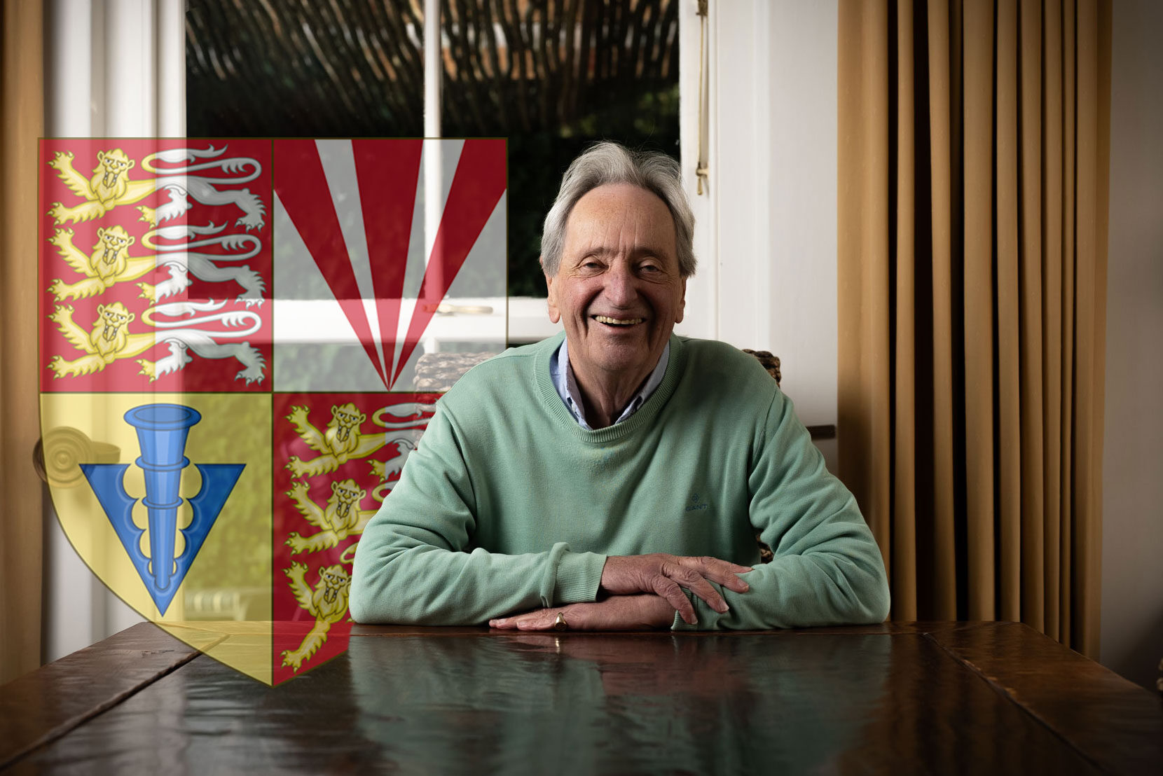 Conor O'Brien, the 19th Baron Inchiquin, sits at a desk with the O'Brien family crest displayed in the background.